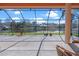 Enjoy this screened-in lanai with a view of the serene lake at 1406 Deerbourne Dr, Wesley Chapel, FL 33543