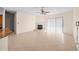 A large, well-lit living area featuring tile floors, a fireplace and access to the patio at 1406 Deerbourne Dr, Wesley Chapel, FL 33543