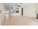 Open living space featuring a tile floor, fireplace, and a kitchen bar area at 1406 Deerbourne Dr, Wesley Chapel, FL 33543