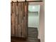 Spacious closet with barn door and built-in shelving at 16118 Hanna Rd, Lutz, FL 33549