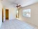 Bright bedroom with tile flooring and a ceiling fan at 16201 Gulf Blvd, Redington Beach, FL 33708