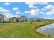 Houses with pond and lush green backyard at 1663 Hazy Sea Dr, Plant City, FL 33565