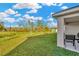 Backyard view of house with patio and pond view at 1663 Hazy Sea Dr, Plant City, FL 33565