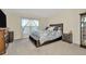 Bedroom with ensuite bath and window coverings at 1663 Hazy Sea Dr, Plant City, FL 33565