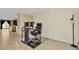 Home office with desk, chair, and view into living area at 1663 Hazy Sea Dr, Plant City, FL 33565