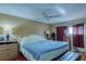 Large bedroom with king-size bed, ceiling fan, and ample closet space at 18675 Us Highway 19 N # 125, Clearwater, FL 33764