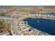 Aerial view of a house by the lake in a quiet, residential neighborhood at 19494 Sea Glass Cir, Land O Lakes, FL 34638