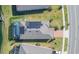 Aerial view of a home with solar panels and pool at 19494 Sea Glass Cir, Land O Lakes, FL 34638