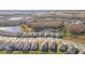 Aerial view of a house nestled in a community with a lake and conservation area at 19494 Sea Glass Cir, Land O Lakes, FL 34638
