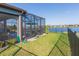 Landscaped backyard with pool and lake view at 19494 Sea Glass Cir, Land O Lakes, FL 34638
