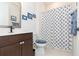 Clean bathroom with shower/tub combo and anchor-themed decor at 19494 Sea Glass Cir, Land O Lakes, FL 34638