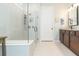 Bathroom with a large walk-in shower and a separate vanity area at 19494 Sea Glass Cir, Land O Lakes, FL 34638