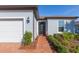 Front entry with brick walkway leading to front door at 19494 Sea Glass Cir, Land O Lakes, FL 34638