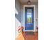 Blue front door with glass panels and welcome mat at 19494 Sea Glass Cir, Land O Lakes, FL 34638