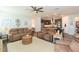 Open living room with kitchen views and comfortable seating at 19494 Sea Glass Cir, Land O Lakes, FL 34638