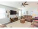 Relaxing living room featuring a cozy seating area and large TV at 19494 Sea Glass Cir, Land O Lakes, FL 34638