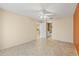 Large bedroom with tile floors and access to bathroom at 2205 Sequoia Dr, Clearwater, FL 33763