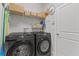 Laundry room with Samsung washer and dryer, shelving at 2244 Spring Lake Ct, Clearwater, FL 33763