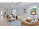 Bright living room with light walls, comfy seating, and tile floors at 2244 Spring Lake Ct, Clearwater, FL 33763