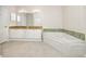Bathroom with double vanity and corner bathtub at 2733 Via Cipriani # 830A, Clearwater, FL 33764
