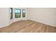 Spacious bedroom with hardwood floors and large windows at 2733 Via Cipriani # 830A, Clearwater, FL 33764