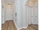 Bright condo entryway with wood-look floors and neutral walls at 2733 Via Cipriani # 830A, Clearwater, FL 33764