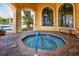 Octagonal hot tub with a handrail at 2733 Via Cipriani # 830A, Clearwater, FL 33764