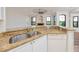 Modern kitchen with granite countertops and stainless steel appliances at 2733 Via Cipriani # 830A, Clearwater, FL 33764
