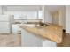 Kitchen with white cabinets, granite countertops, and appliances at 2733 Via Cipriani # 830A, Clearwater, FL 33764