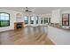 Spacious living room with hardwood floors, fireplace, and large windows at 2733 Via Cipriani # 830A, Clearwater, FL 33764
