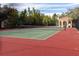 Community tennis court with red and green surface at 2733 Via Cipriani # 830A, Clearwater, FL 33764