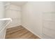 Large walk-in closet with wire shelving at 2733 Via Cipriani # 830A, Clearwater, FL 33764