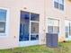 Screened patio and AC unit in the backyard of the home at 30405 Elderwood Dr, Wesley Chapel, FL 33543