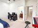 Bedroom with workspace, en-suite bathroom, and hallway view at 30405 Elderwood Dr, Wesley Chapel, FL 33543