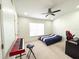 Bright bedroom with double bed, desk, and window coverings at 30405 Elderwood Dr, Wesley Chapel, FL 33543