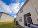 View of the back exterior of the home and surrounding area at 30405 Elderwood Dr, Wesley Chapel, FL 33543