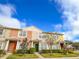 Front view of townhome with well-maintained landscaping at 30405 Elderwood Dr, Wesley Chapel, FL 33543