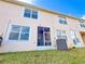 Back exterior view of the home showing screened patio at 30405 Elderwood Dr, Wesley Chapel, FL 33543