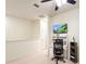Home office with a desk, chair, and stationary bike at 30405 Elderwood Dr, Wesley Chapel, FL 33543