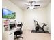 Home office with a desk, chair, and stationary bike at 30405 Elderwood Dr, Wesley Chapel, FL 33543