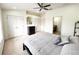 Main bedroom with king-size bed and en-suite bathroom at 30405 Elderwood Dr, Wesley Chapel, FL 33543