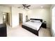 Spacious main bedroom with king-size bed and en-suite bathroom at 30405 Elderwood Dr, Wesley Chapel, FL 33543