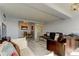 Spacious living room with leather sofas and a view to the dining area at 31 Island Way # 609, Clearwater Beach, FL 33767