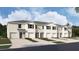 New townhome community with 4-unit buildings, 2-car garages, and landscaping at 31286 Midnight Sun Way, Wesley Chapel, FL 33545