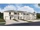 New townhome community with three-unit buildings and attached garages at 31294 Midnight Sun Way, Wesley Chapel, FL 33545