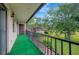 Private balcony overlooks grassy area with mature trees at 7020 Cognac Dr # 3, New Port Richey, FL 34653