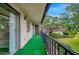 Private balcony with artificial turf and views of nature at 7020 Cognac Dr # 3, New Port Richey, FL 34653