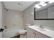 Bathroom with tub, shower, white vanity, and a mirror at 7020 Cognac Dr # 3, New Port Richey, FL 34653