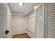 Large walk-in closet with built-in shelving and a louvered door at 7020 Cognac Dr # 3, New Port Richey, FL 34653