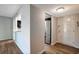 Entryway with view into kitchen and stainless steel refrigerator at 7020 Cognac Dr # 3, New Port Richey, FL 34653